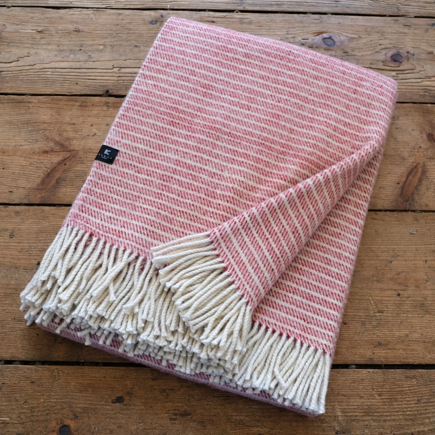 Large red striped woolen blanket made of natural wool